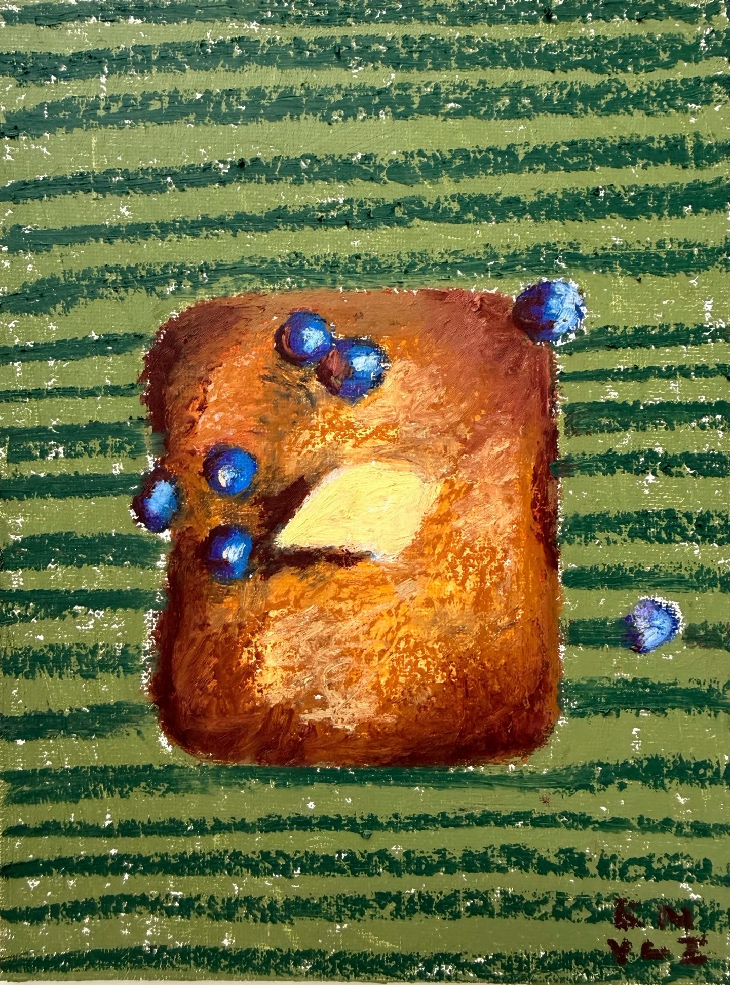 French toast with butter and blueberries on a green striped ground