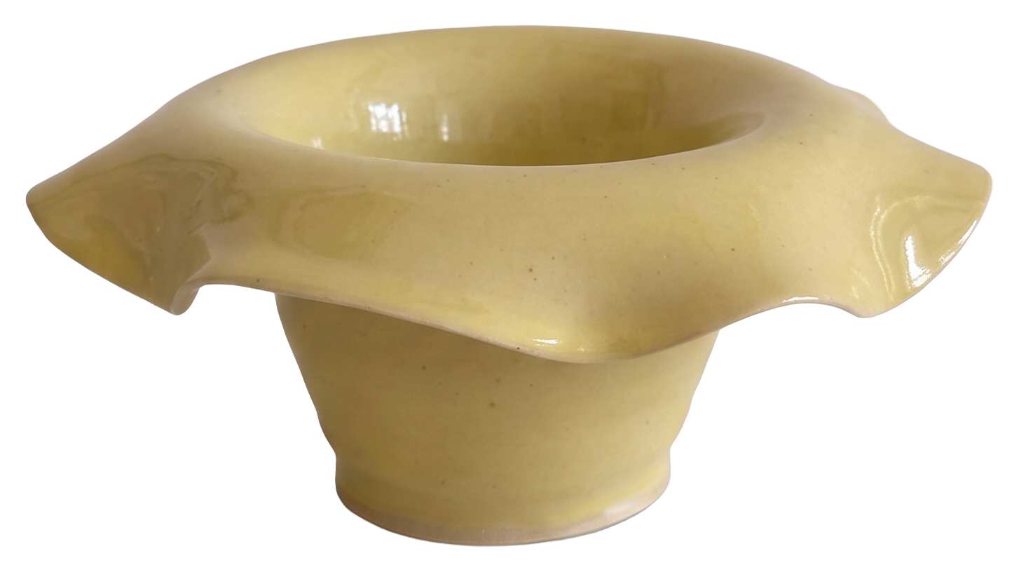 Sunny yellow glazed stoneware bowl with an asymmetric wavy rim
